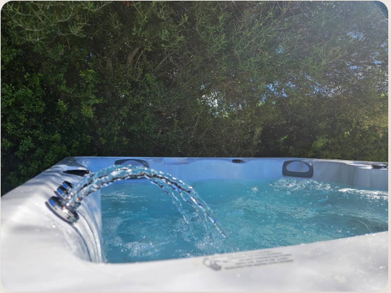The waterfall feature of the Waterwave BS 302 running beside the pool at Casa Viduleto