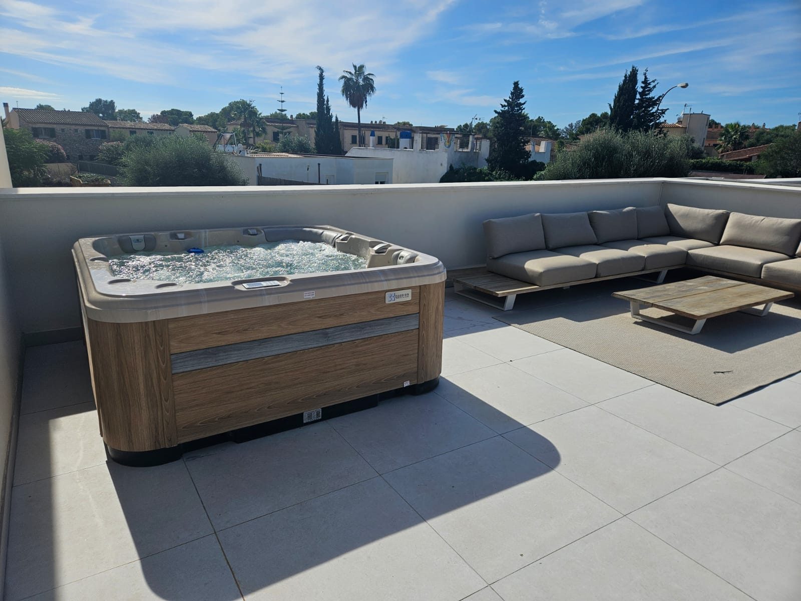 The Relax on the roof terrace with the lounge set and the view over the village