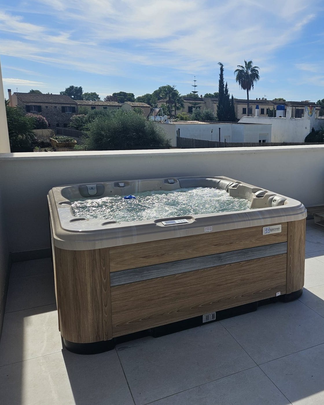 The Relax whirlpool running on the roof terrace in Sa Vinyola, Campos, with the view over the village