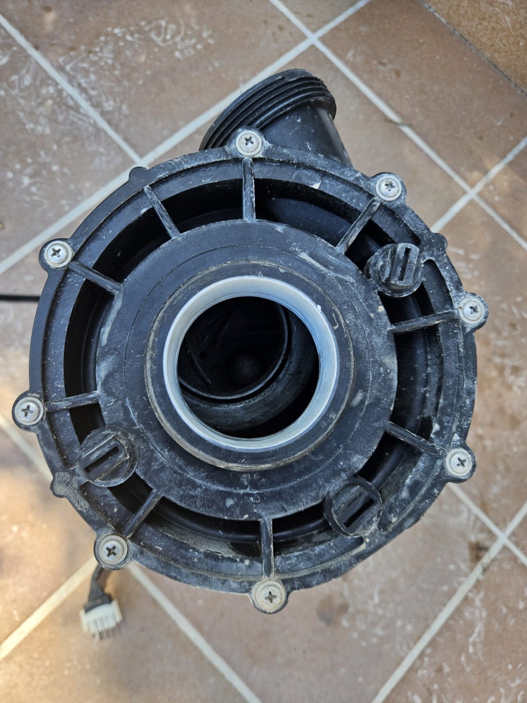 The removed pump housing showing the damaged connection on the suction side
