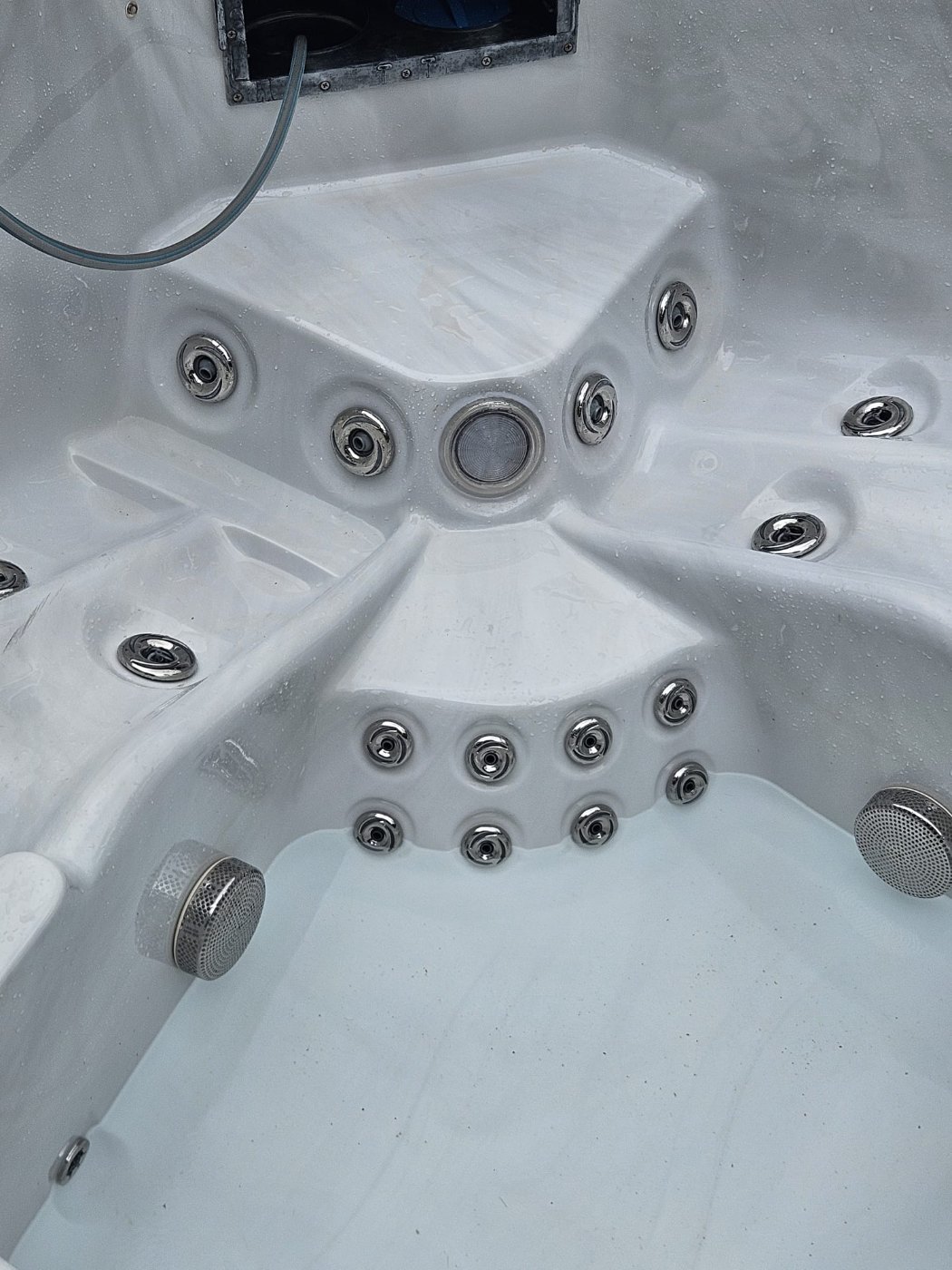 The new light fitted flush into the spa shell between the jets, before the whirlpool was refilled