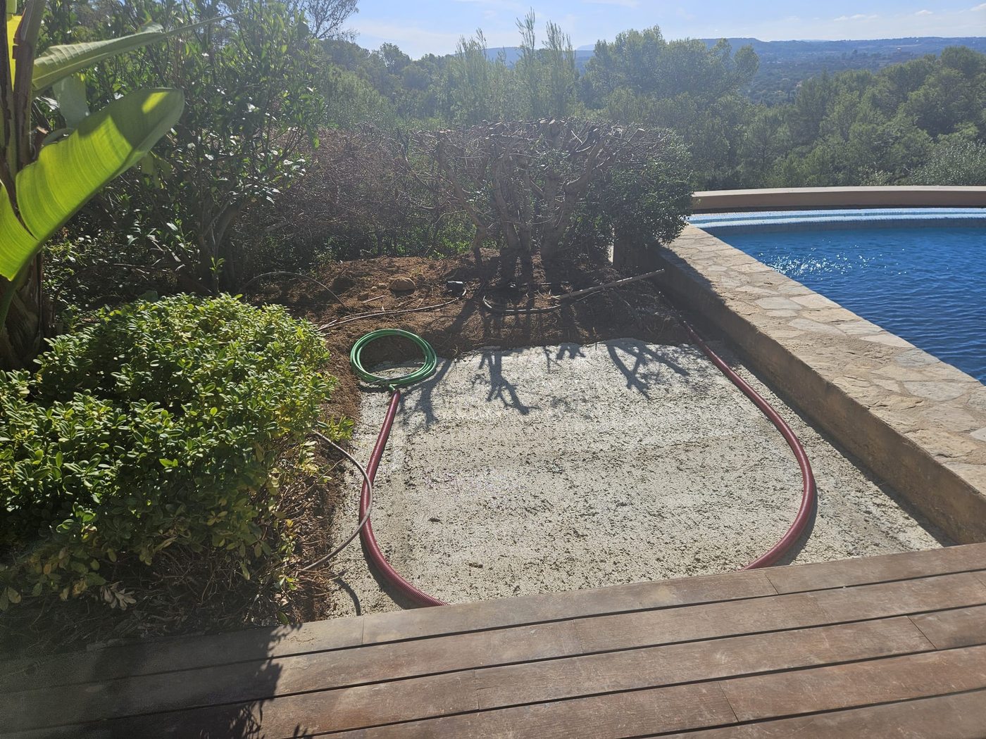 The new concrete foundation cast beside the pool to carry the whirlpool