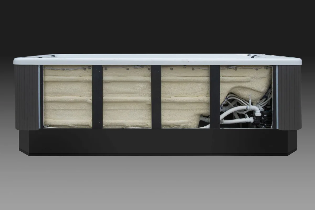 Swim spa internal structure showing insulation and pump installation
